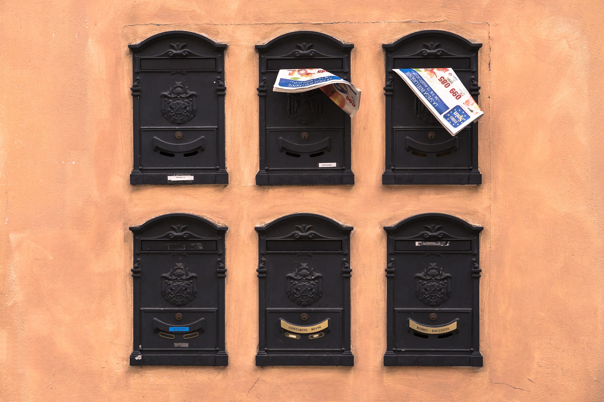 six black wooden mailboxes